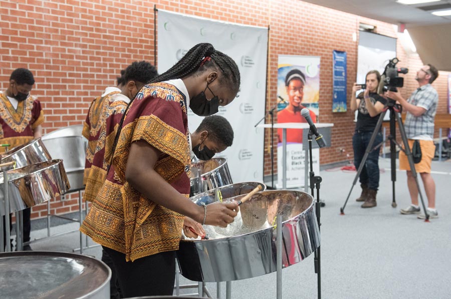 Students from the Africentric Alternative School play steelpan drums. Open Gallery